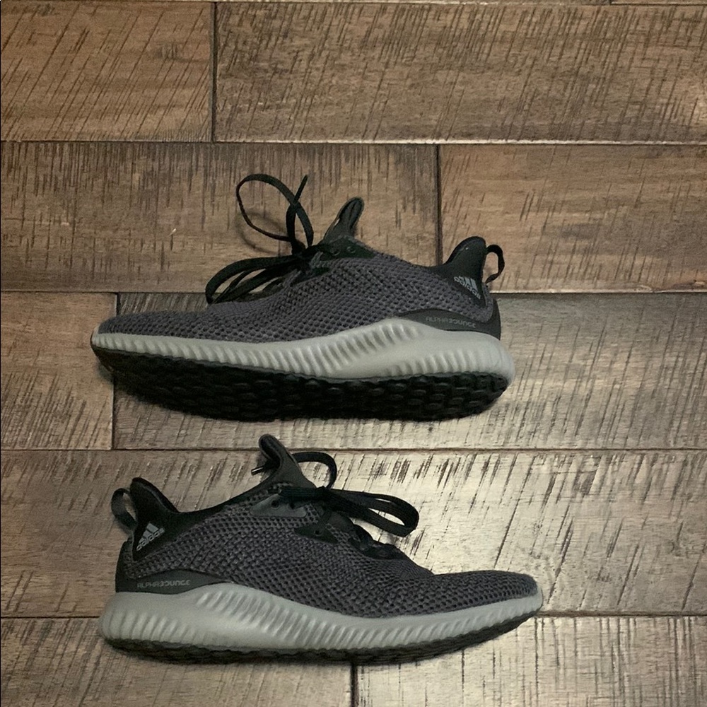 Adidas Black and Gray Sneakers with Knit Mesh Upper and Cushioned Sole.
